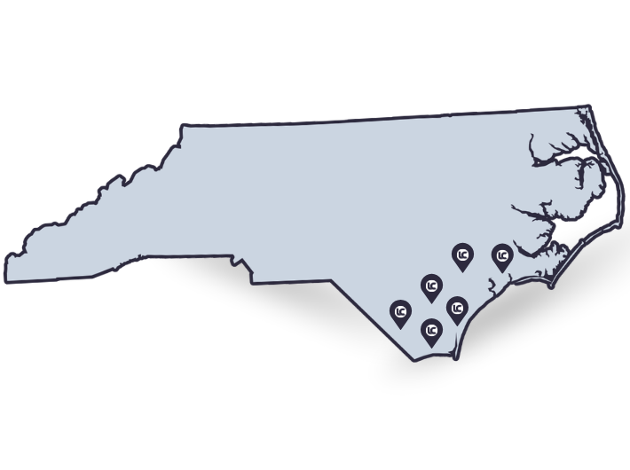 Loral Concrete Residential service area map showing coverage around Holly Ridge, Burgaw, Whiteville, Shallotte, Oak Island, and Wilmington, North Carolina.